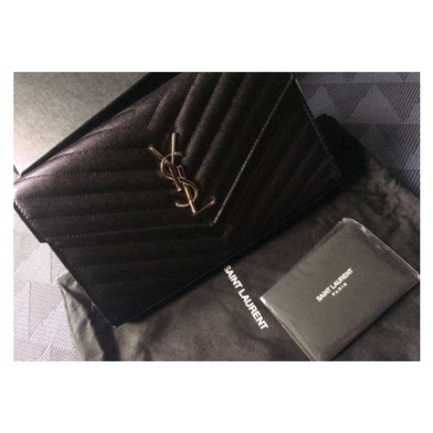 ysl black clutch bag with tassel|YSL clutch price.